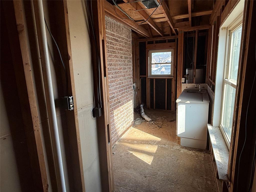 408 West Walnut Street Decatur, TX 76234 - Photo 12 of 14 a view of hallway with washer and dryer