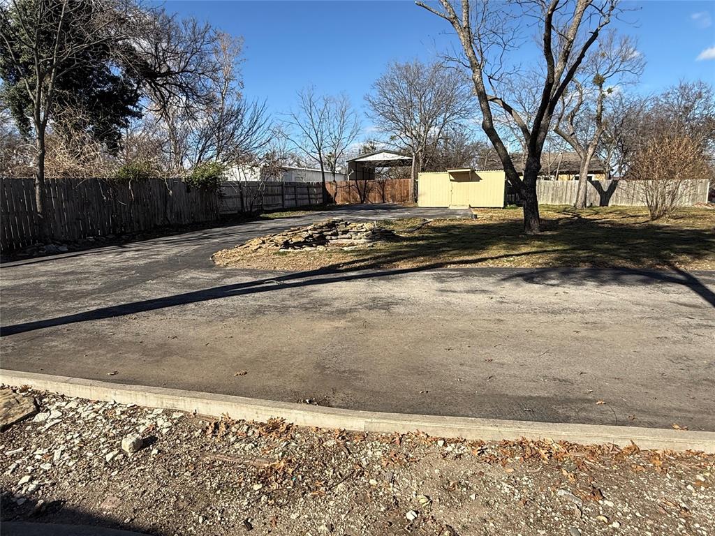 408 West Walnut Street Decatur, TX 76234 - Photo 14 of 14 a view of a yard with snow on the road