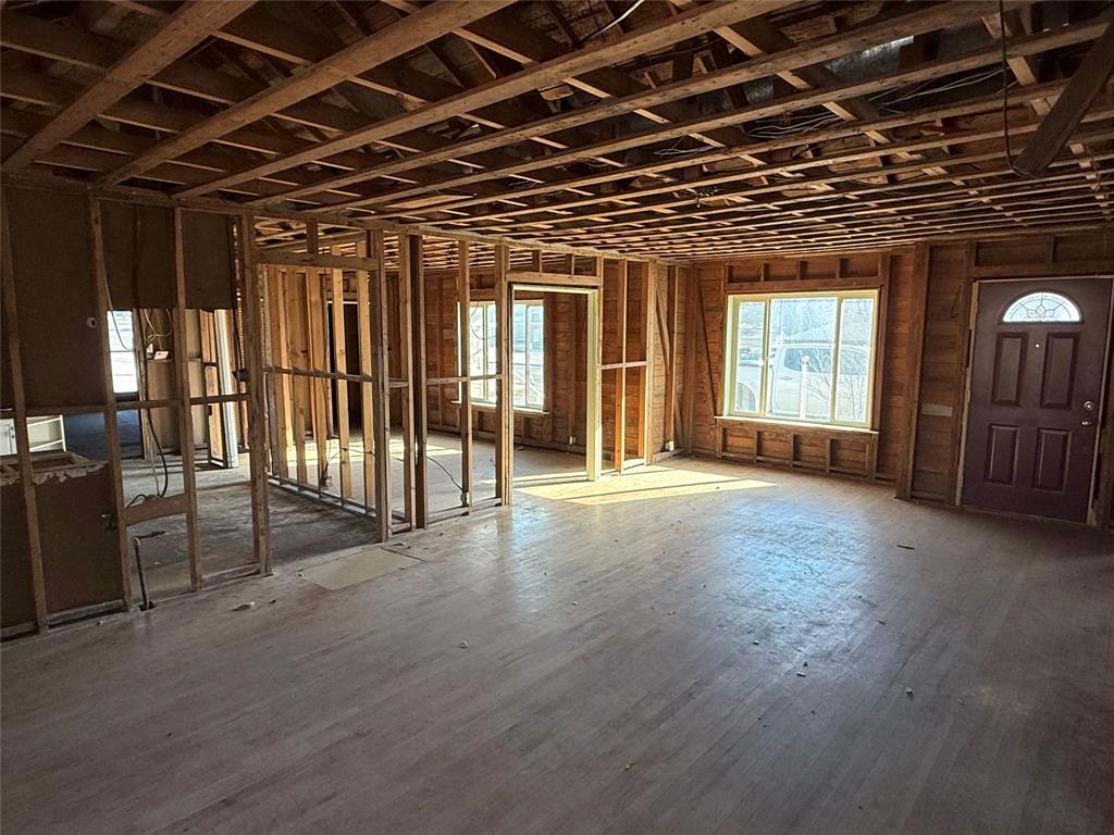 408 West Walnut Street Decatur, TX 76234 - Photo 3 of 14 a view of empty room with wooden floor