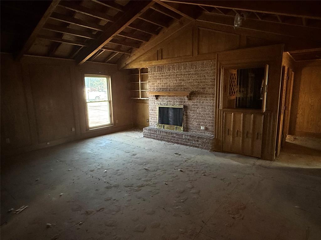 408 West Walnut Street Decatur, TX 76234 - Photo 5 of 14 a view of empty room with a fireplace