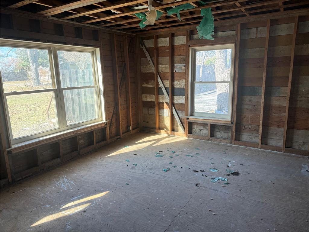 408 West Walnut Street Decatur, TX 76234 - Photo 8 of 14 a view of an empty room with a window