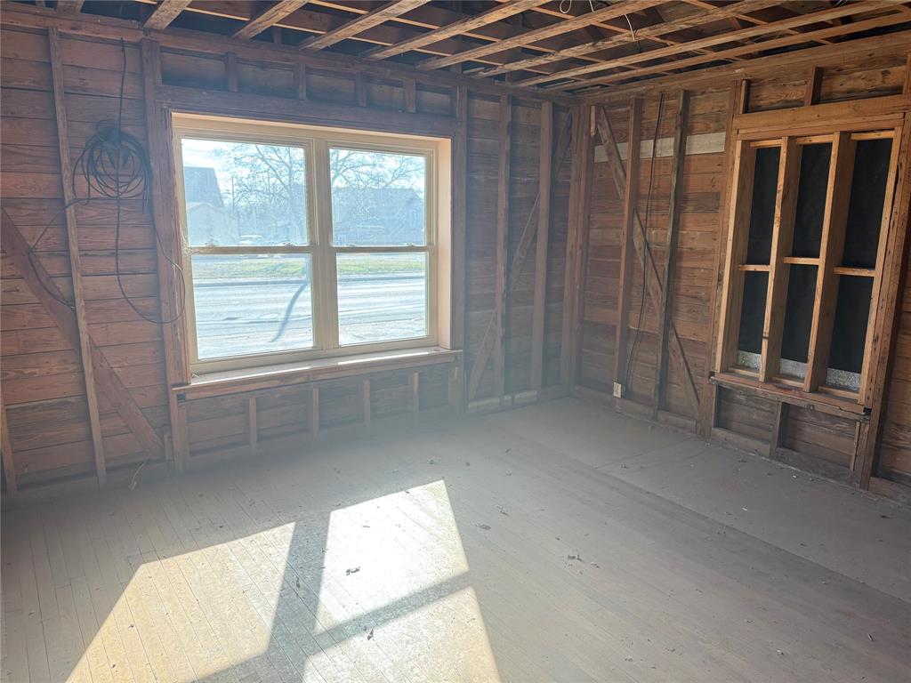 408 West Walnut Street Decatur, TX 76234 - Photo 10 of 14 a view of an empty room with a window