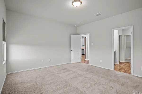 a bathroom with a sink a mirror and a shower
