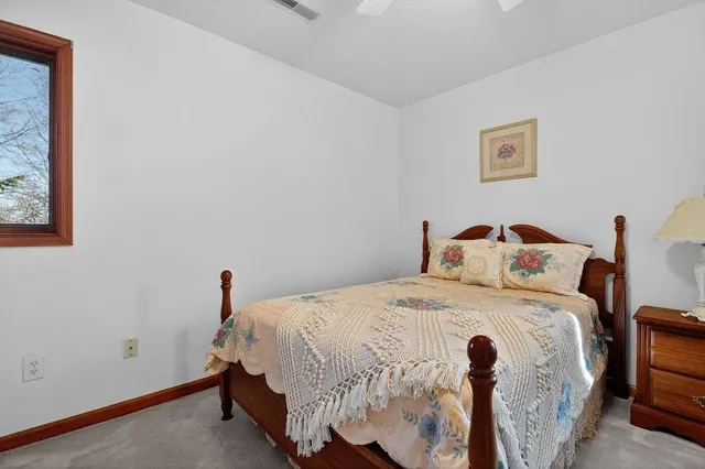 a living room with furniture a chandelier and a flat screen tv