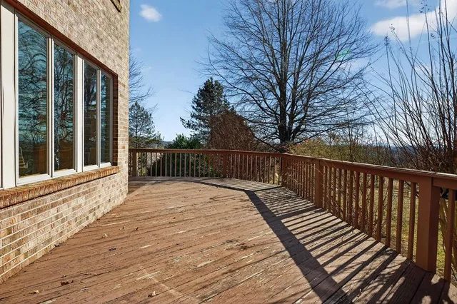 an aerial view of a house with a yard and wooden floor