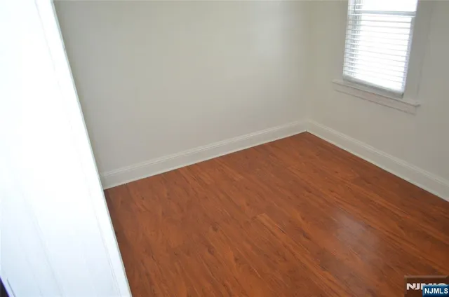 a kitchen with granite countertop a stove and a microwave