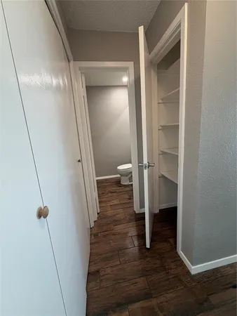 a view of a room with wooden floor and staircase
