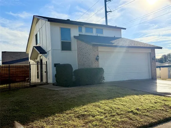a view of a house with a backyard
