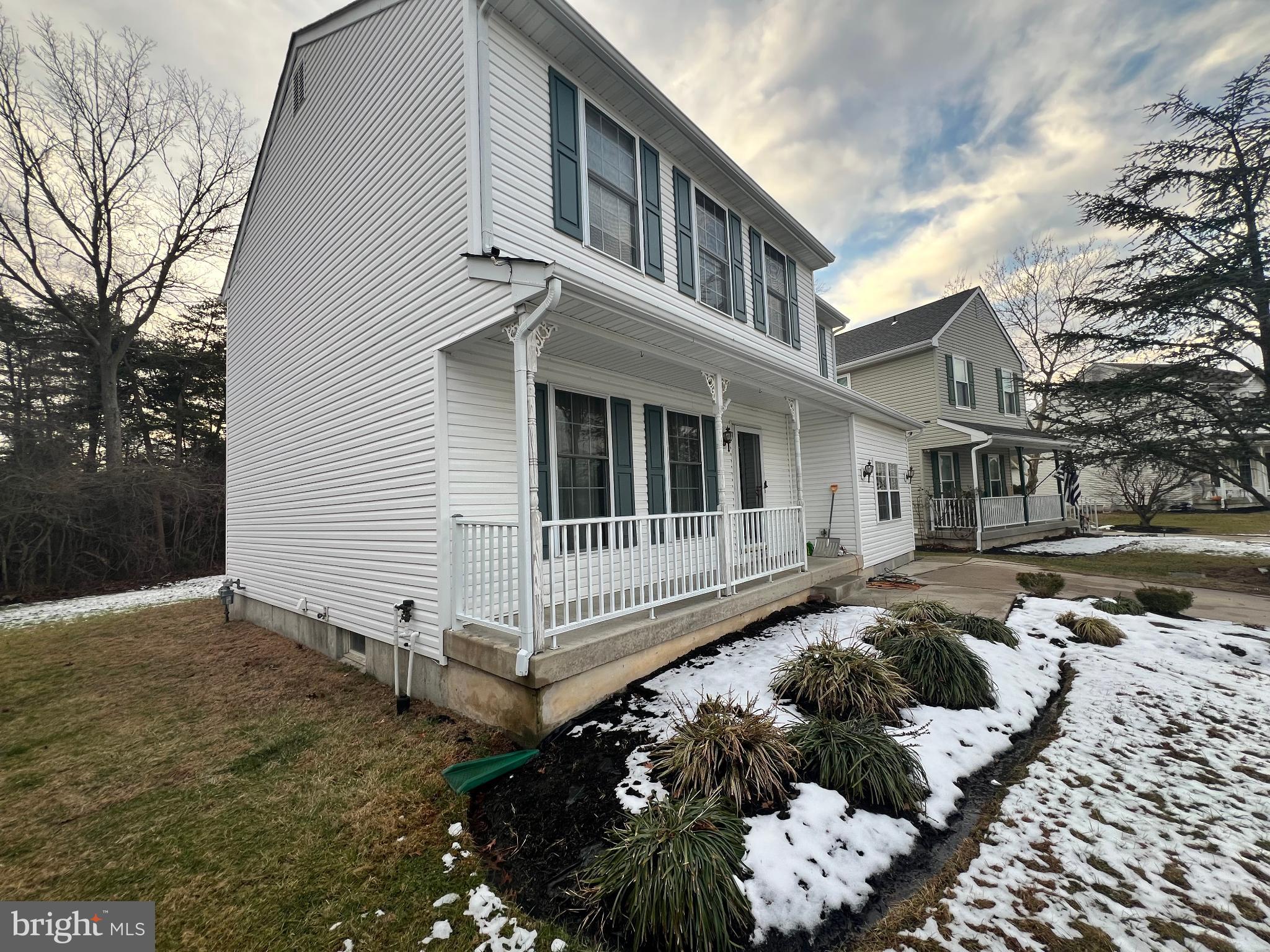 18 Wakefield Road Atco, NJ 08004 - Photo 6 of 6 Charming home with inviting porch and greenery.