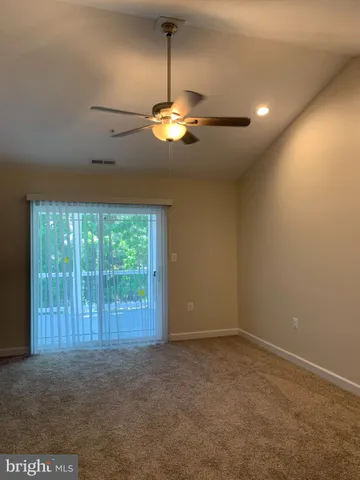 a view of a chandelier fan in a room
