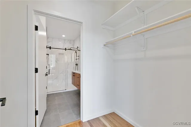 a bathroom with a shower and a sink