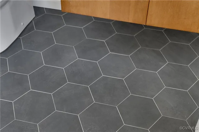 a bathroom with a shower and a sink