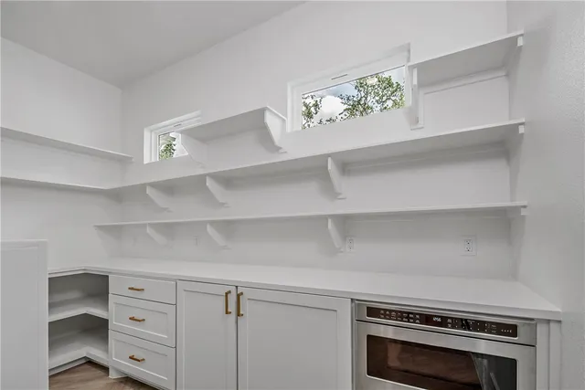a large kitchen with a lot of counter space and a sink