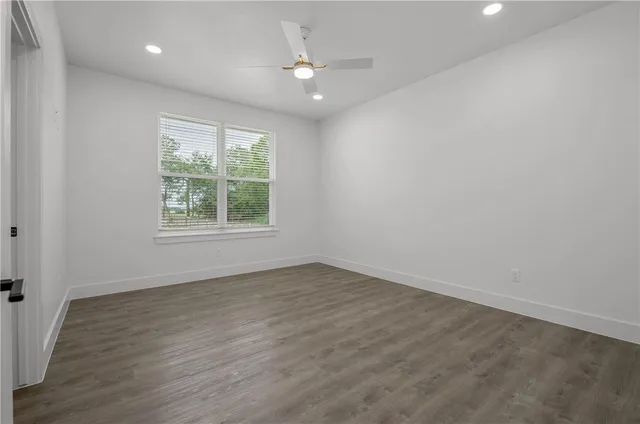 a bathroom with a bathtub a shower and vanity