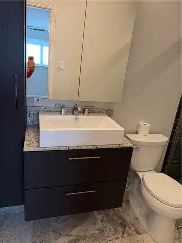 a bathroom with a sink and a toilet