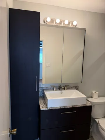 a bathroom with a sink and a mirror