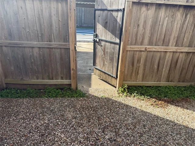 a view of outdoor space with wooden fence
