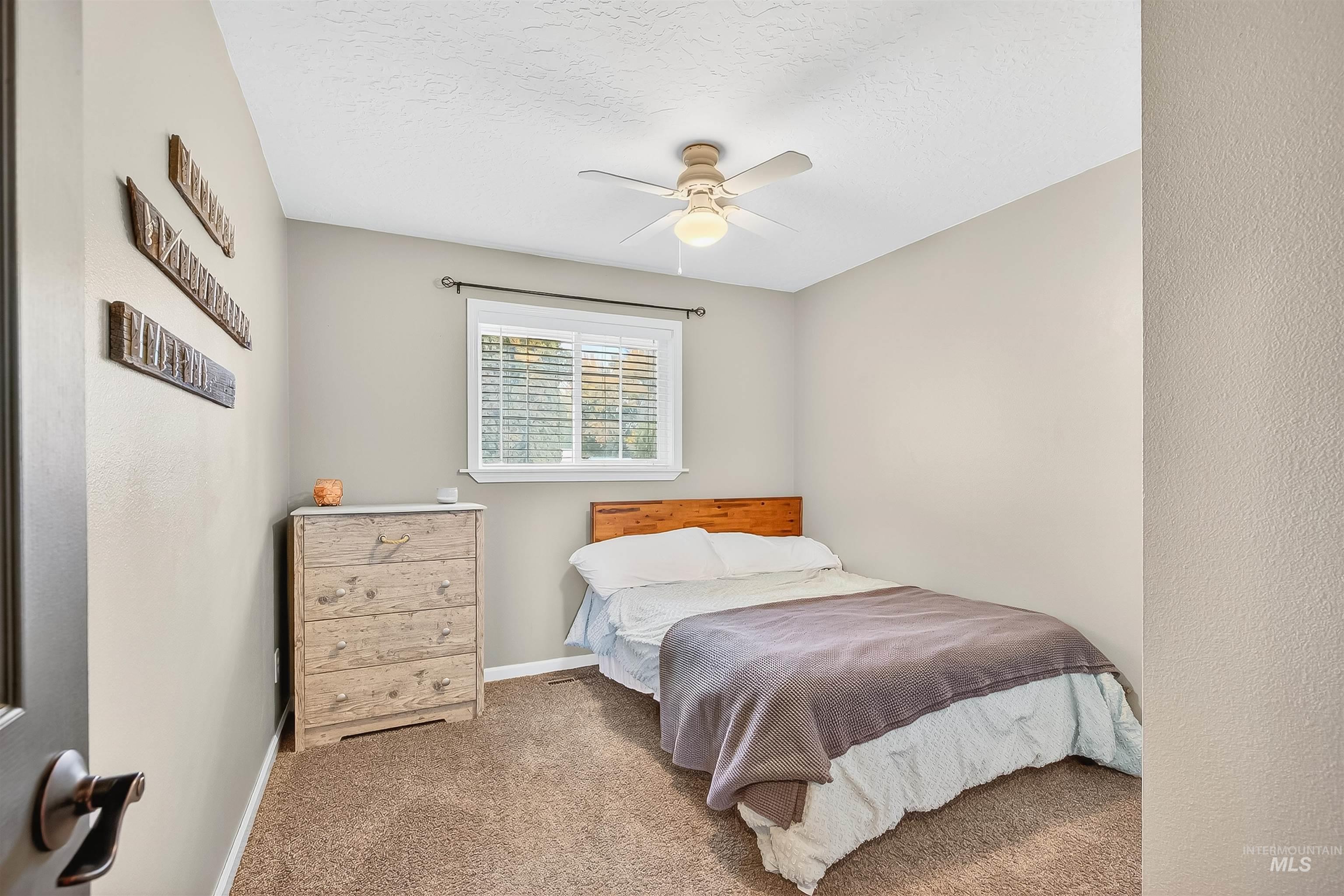 1220 Birch Avenue Lewiston, ID 83501 - Photo 14 of 45 Bedroom with carpet flooring, a textured ceiling, and ceiling fan