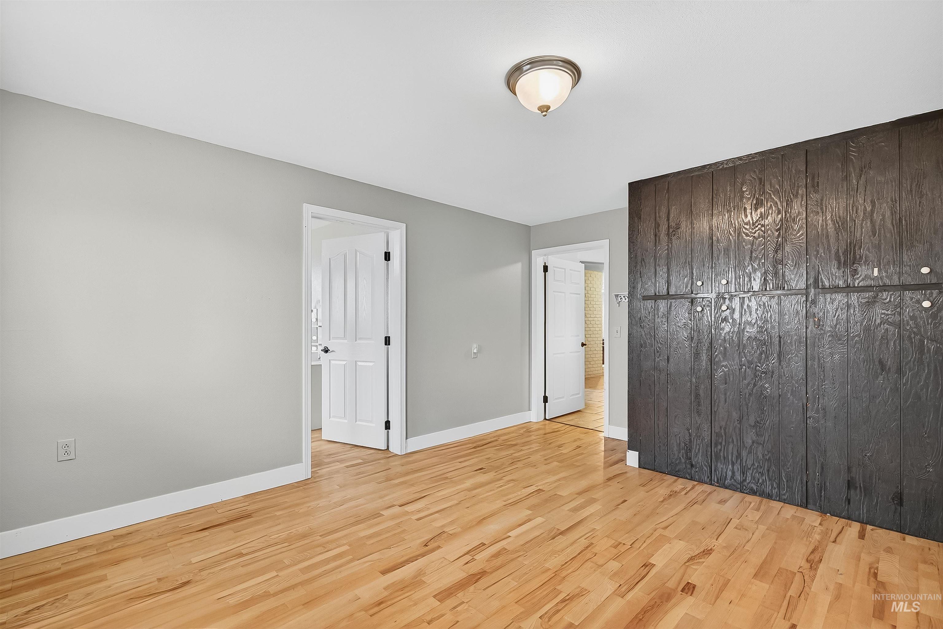 1220 Birch Avenue Lewiston, ID 83501 - Photo 33 of 45 Unfurnished bedroom with light wood finished floors and baseboards