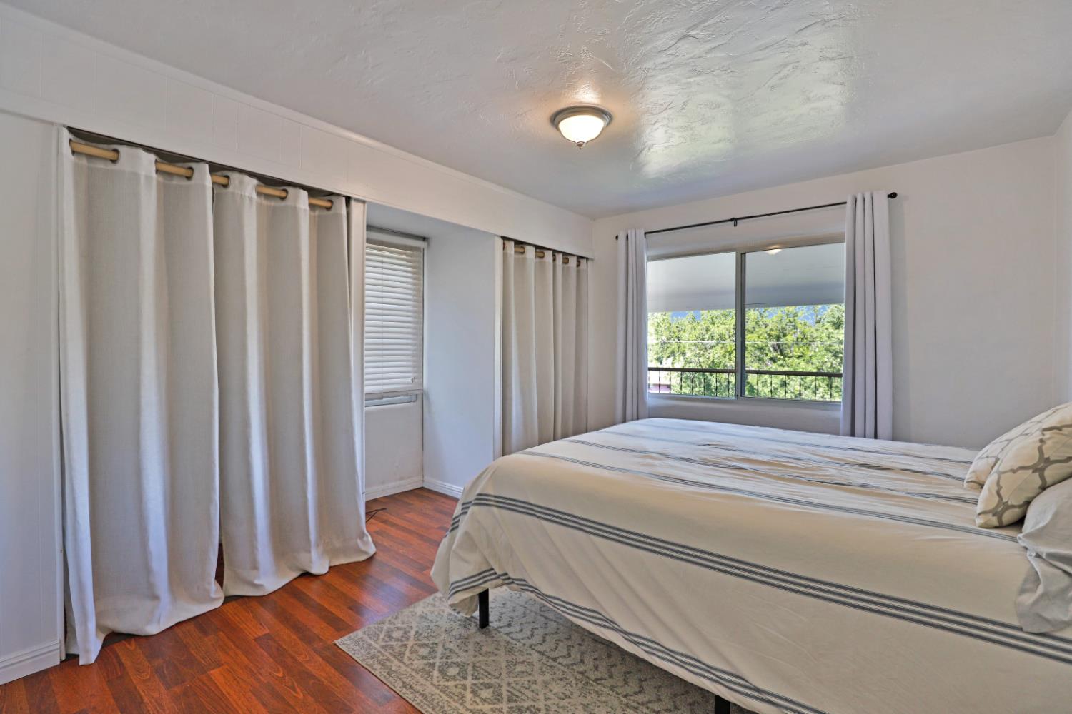 207 Peek Street Jackson, CA 95642 - Photo 13 of 30 a bedroom with a bed and a window