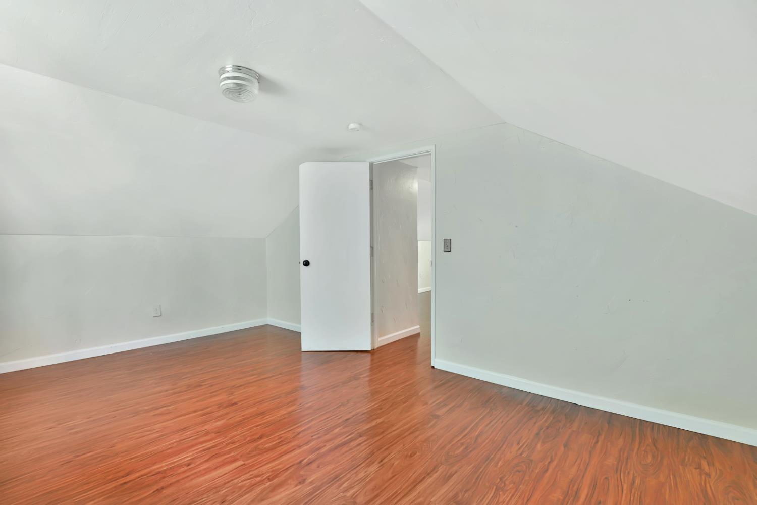 207 Peek Street Jackson, CA 95642 - Photo 20 of 30 a view of an empty room with wooden floor