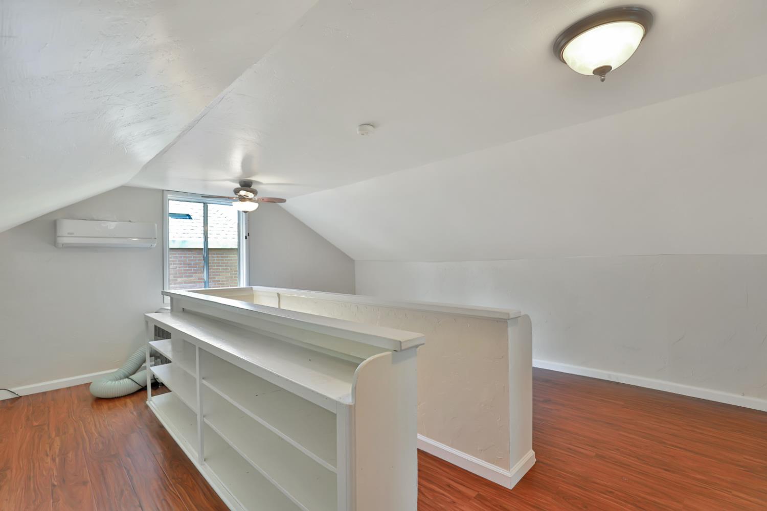 207 Peek Street Jackson, CA 95642 - Photo 22 of 30 a view of room and wooden floor