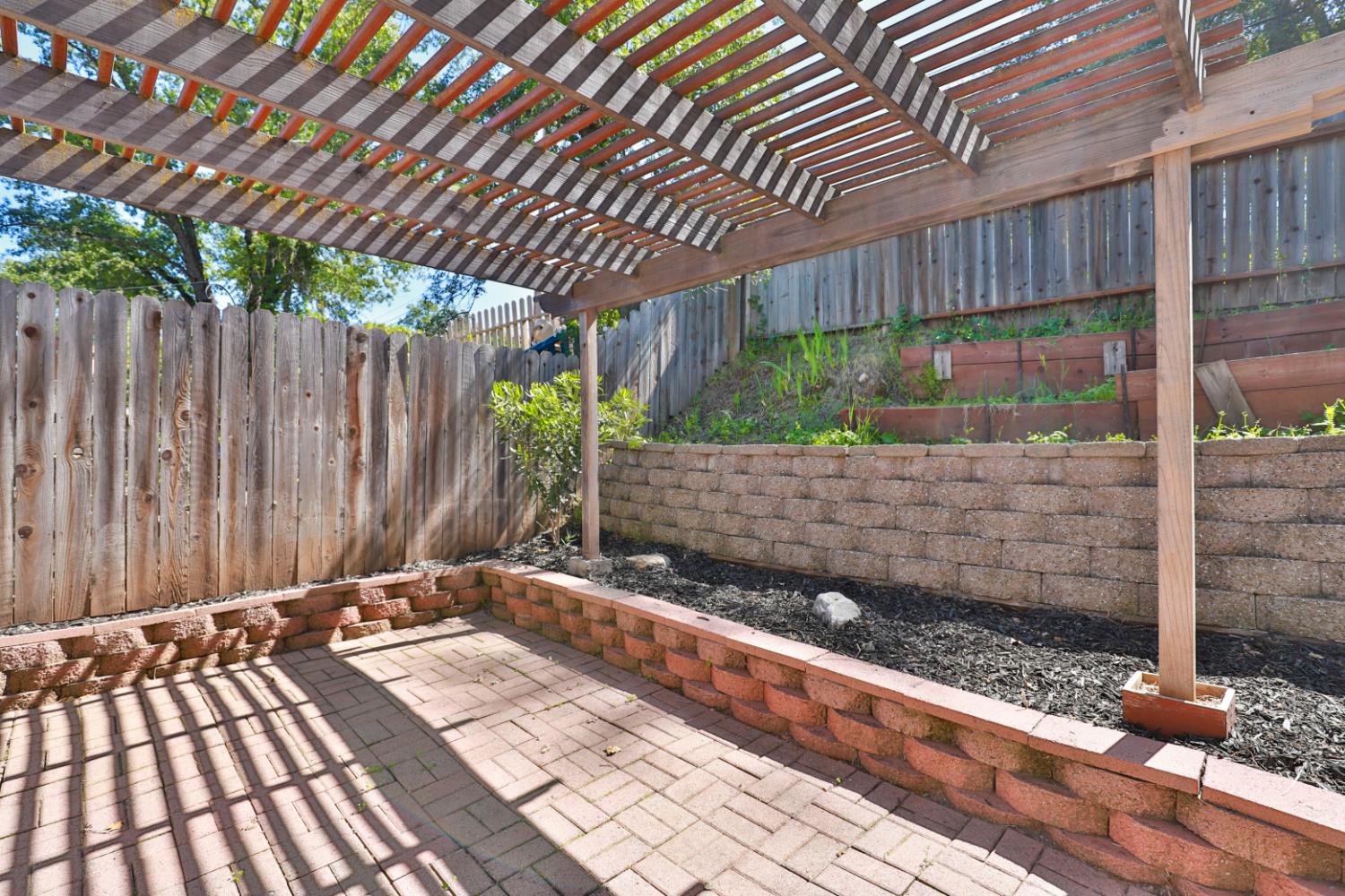 207 Peek Street Jackson, CA 95642 - Photo 29 of 30 a backyard of a house with a garden