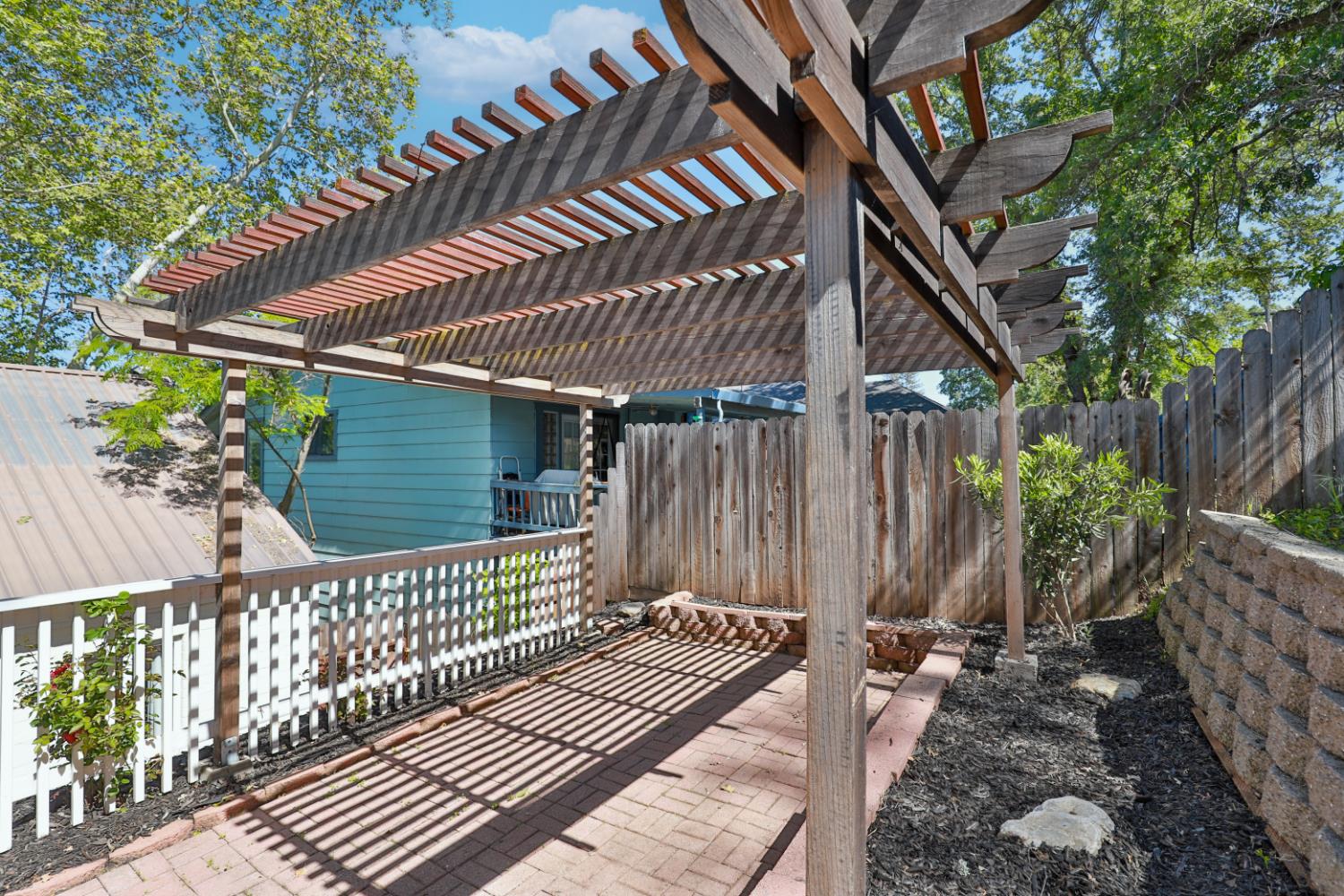 207 Peek Street Jackson, CA 95642 - Photo 30 of 30 a side view of a house with a deck