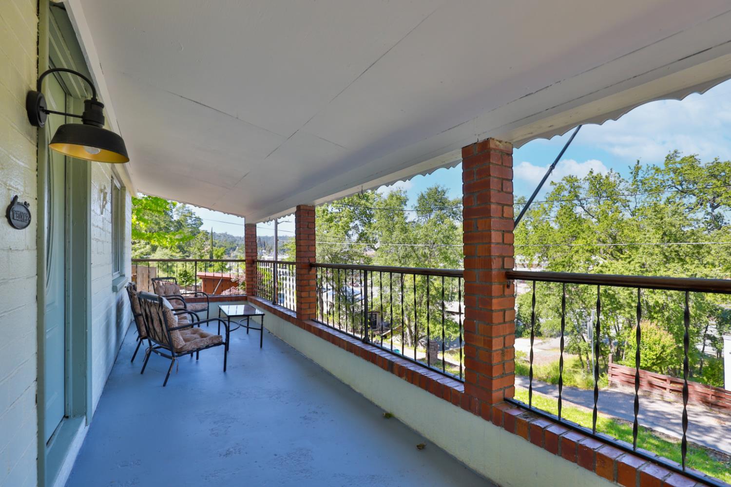 207 Peek Street Jackson, CA 95642 - Photo 3 of 30 a dining room with furniture and a floor to ceiling window