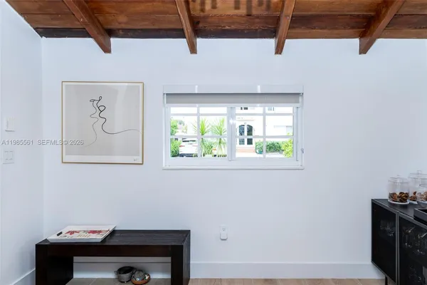 a room with furniture and a large window