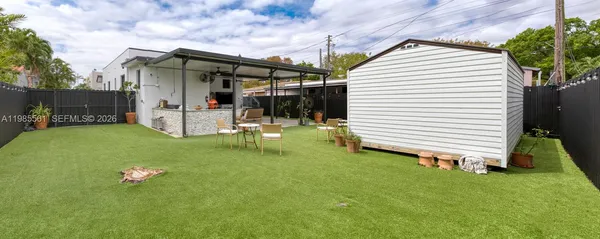 a backyard of a house with seating space