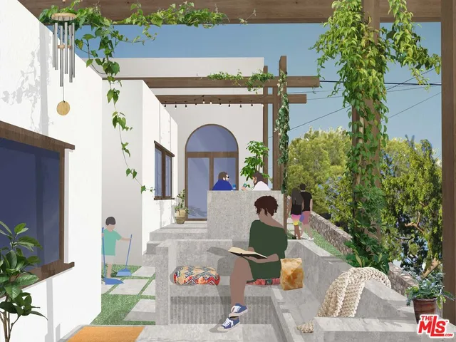 a front view of a house with outdoor seating