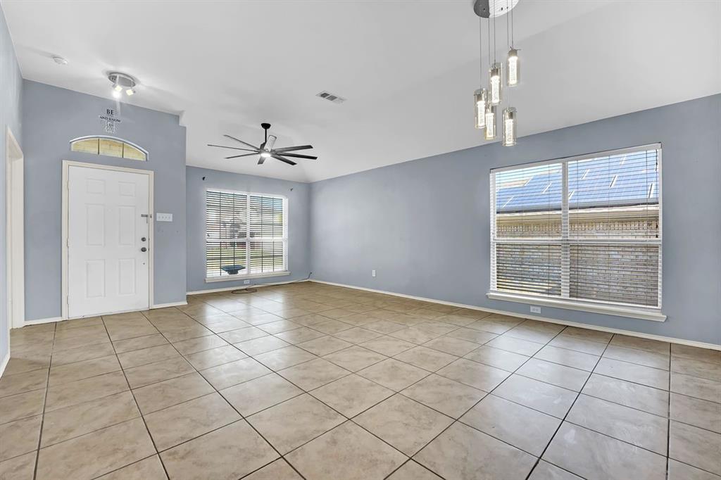 1708 Windcastle Drive Mansfield, TX 76063 - Photo 5 of 28 a view of an empty room with a window