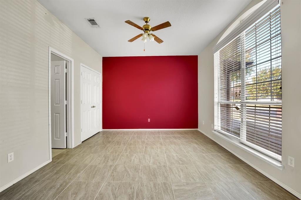 1708 Windcastle Drive Mansfield, TX 76063 - Photo 7 of 28 an empty room with windows and a ceiling fan