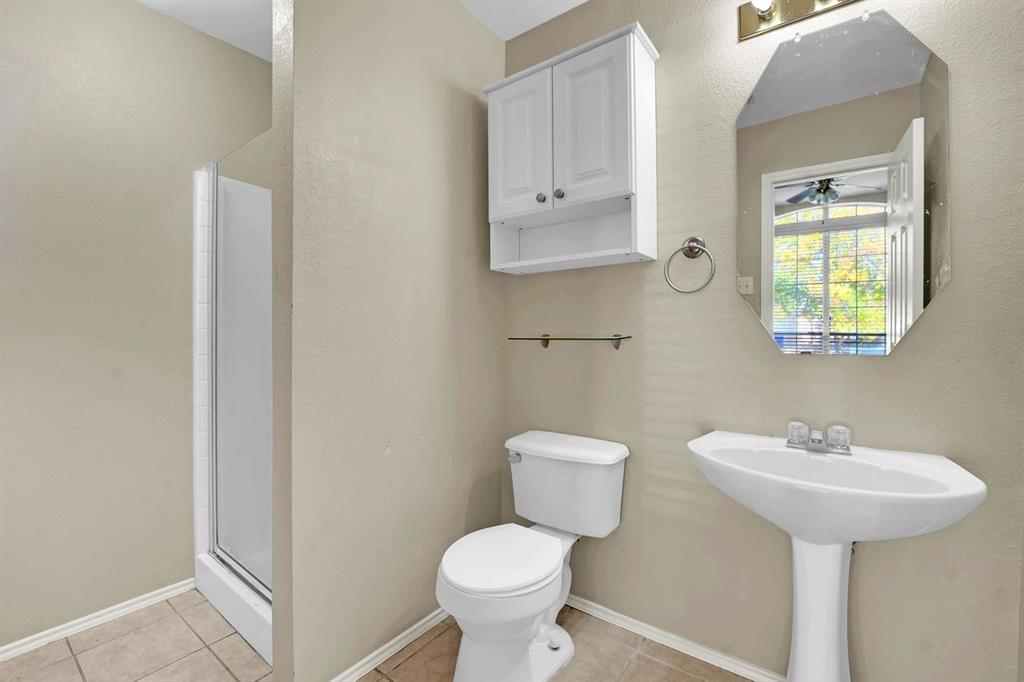 1708 Windcastle Drive Mansfield, TX 76063 - Photo 9 of 28 a bathroom with a sink toilet and a mirror