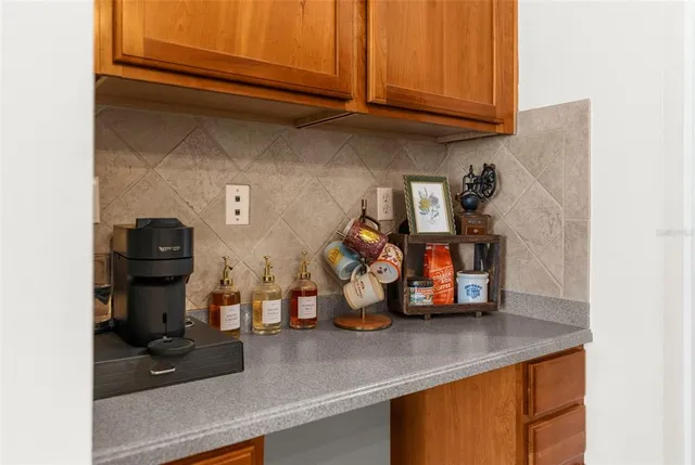 a view of a sink with storage and utility room