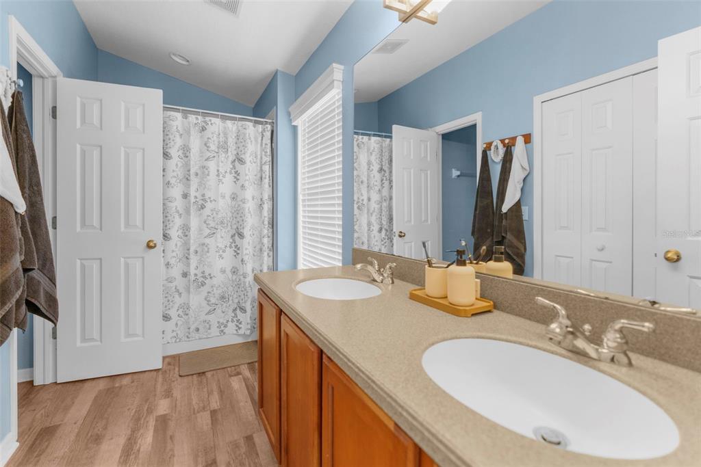 8546 Great Egret Trace New Port Richey, FL 34653 - Photo 14 of 21 a bathroom with a granite countertop sink and a mirror