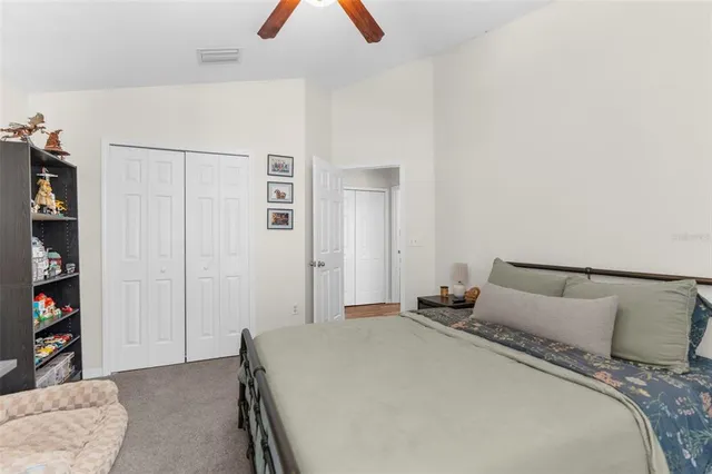 a bedroom with a bed and closet