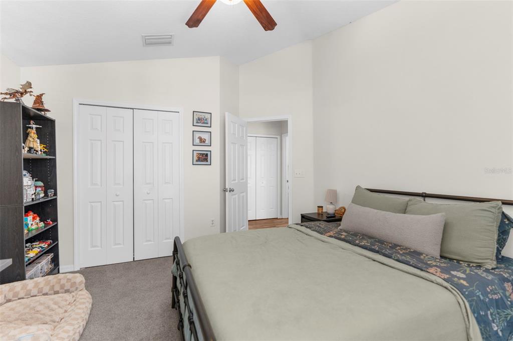 8546 Great Egret Trace New Port Richey, FL 34653 - Photo 16 of 21 a bedroom with a bed and closet