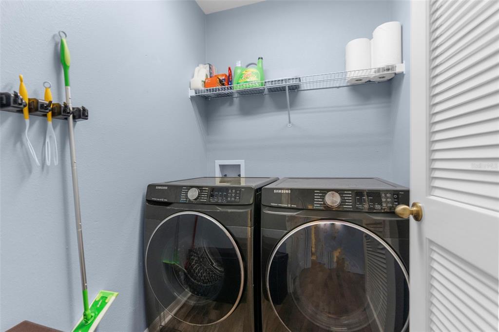 8546 Great Egret Trace New Port Richey, FL 34653 - Photo 18 of 21 a utility room with dryer and washer