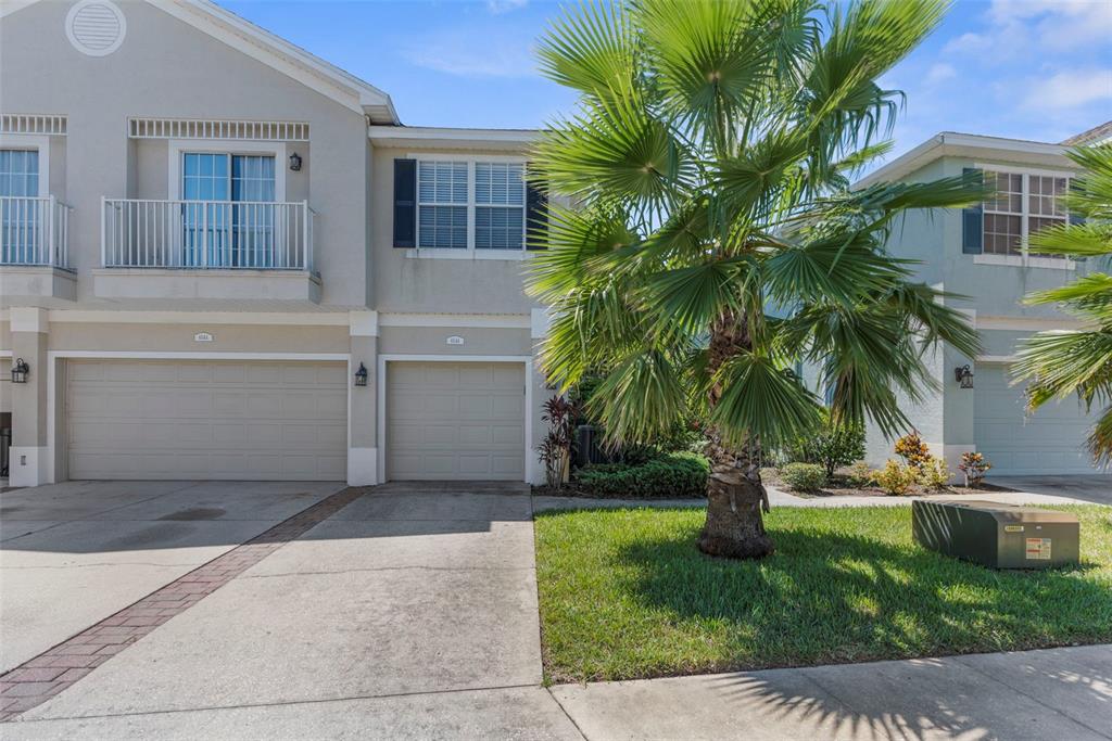 8546 Great Egret Trace New Port Richey, FL 34653 - Photo 21 of 21 a front view of house with yard and green space