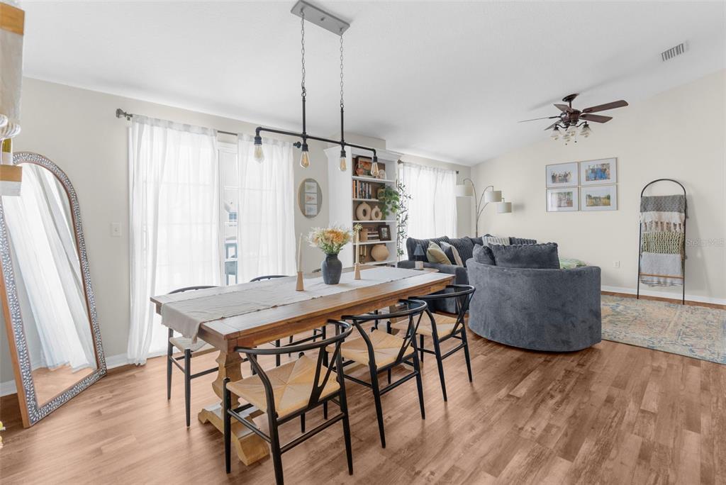 8546 Great Egret Trace New Port Richey, FL 34653 - Photo 6 of 21 a view of a dining room with furniture window and wooden floor