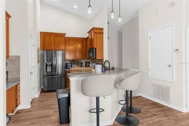 a kitchen with stainless steel appliances a refrigerator and a sink