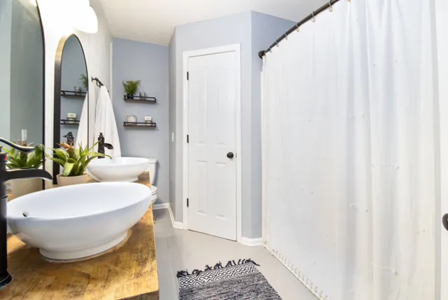 a bathroom with a sink and a mirror
