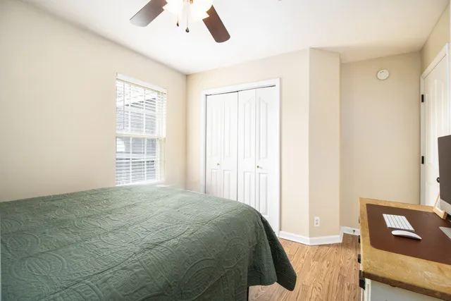 a bedroom with a bed and a window