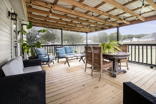 a view of a chairs and table in the patio
