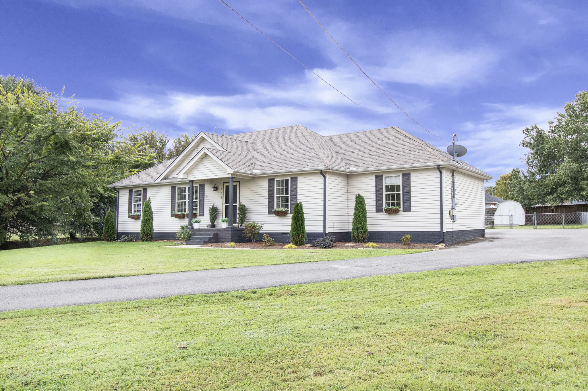 119 Jeremiah Court Rockvale, TN 37153 - Photo 24 of 26 a front view of a house with a garden and porch