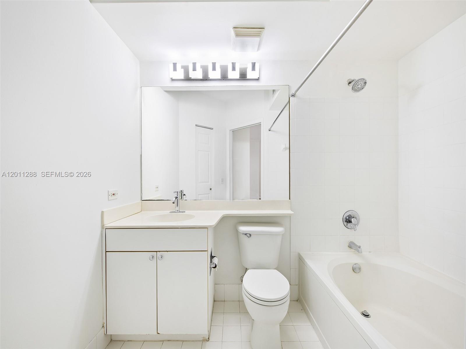 17100 North Bay Road, Unit 1614 Sunny Isles Beach, FL 33160 - Photo 13 of 17 a bathroom with a sink a toilet and bathtub