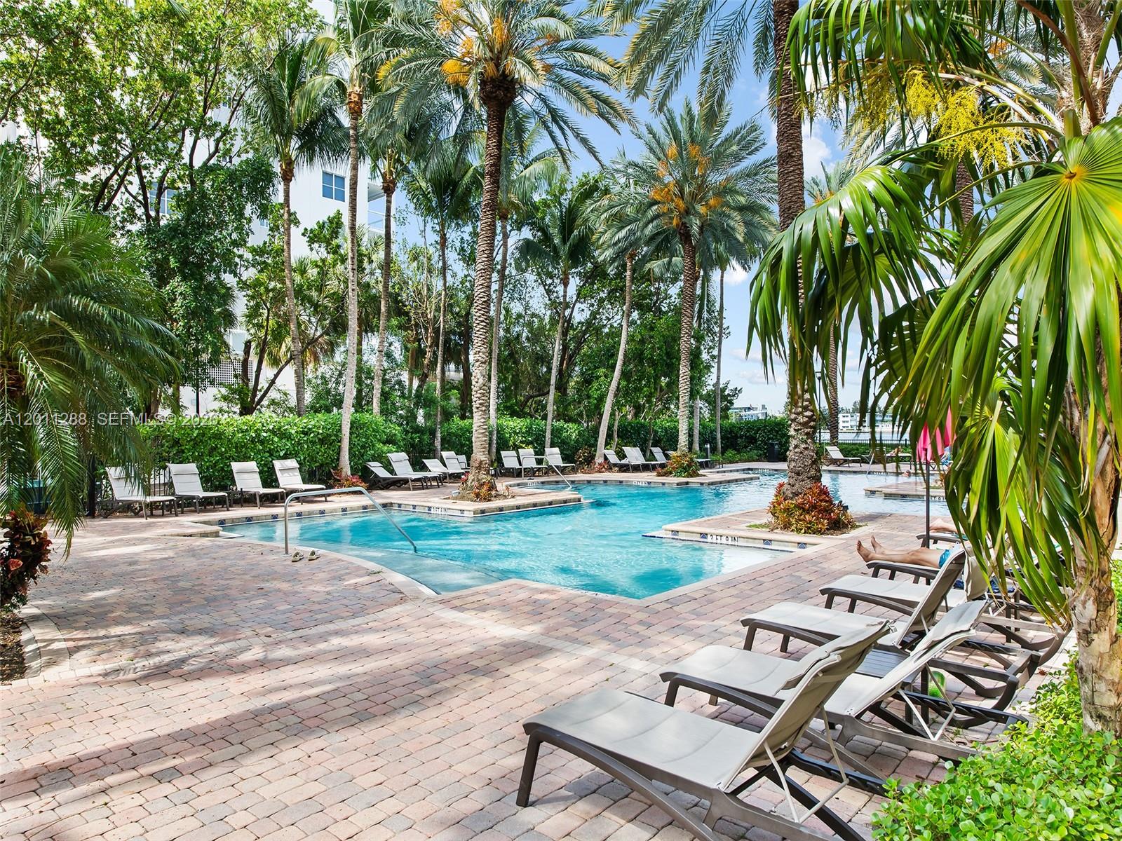 17100 North Bay Road, Unit 1614 Sunny Isles Beach, FL 33160 - Photo 16 of 17 a view of a yard with palm trees