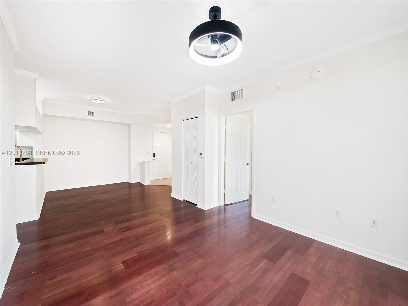 17100 North Bay Road, Unit 1614 Sunny Isles Beach, FL 33160 - Photo 5 of 17 a view of a room with wooden floor and white walls